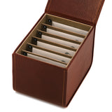Case for guitar strings, dark brown leather, opened with strings in envelopes